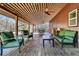Relaxing porch area with ceiling fans and comfortable seating, perfect for outdoor enjoyment at 5219 Maybank Hwy, Wadmalaw Island, SC 29487