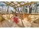 Treehouse deck with a translucent roof and matching stools at 5219 Maybank Hwy, Wadmalaw Island, SC 29487