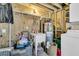 Utility room with water heater, utility sink, and laundry appliances at 5219 Maybank Hwy, Wadmalaw Island, SC 29487