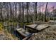 A small boat sits by a pier on a murky waterfront at 5219 Maybank Hwy, Wadmalaw Island, SC 29487