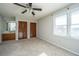 Bedroom with large window, double closets, and an ensuite sink at 5567 Evelyn Dr, North Charleston, SC 29418