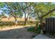 A backyard with a small patio with marshland and trees, featuring a unique drainage system at 607 Saint Charles Ct, Charleston, SC 29407