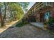 A backyard with a small patio with marshland and trees, surrounded by other patio units at 607 Saint Charles Ct, Charleston, SC 29407