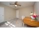 Bedroom featuring neutral walls, ceiling fan, and two entry doors plus a cozy workspace at 607 Saint Charles Ct, Charleston, SC 29407