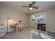 Bedroom featuring neutral walls, ceiling fan, and a window with work station and shelves for storage at 607 Saint Charles Ct, Charleston, SC 29407