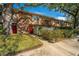 Attractive townhome exterior featuring lush landscaping, brick, and wood accents at 607 Saint Charles Ct, Charleston, SC 29407