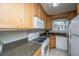 The well-equipped kitchen features light wood cabinetry, granite countertops, and stainless steel appliances at 607 Saint Charles Ct, Charleston, SC 29407