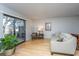 Bright living room with bamboo floors, a sliding glass door, and neutral furnishings at 607 Saint Charles Ct, Charleston, SC 29407