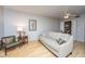 Cozy living room showcasing a neutral sofa, bamboo flooring, and a ceiling fan at 607 Saint Charles Ct, Charleston, SC 29407