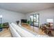 Bright living room with light walls, bamboo floors, and a sliding glass door at 607 Saint Charles Ct, Charleston, SC 29407