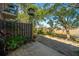 Relaxing patio area with a view of the marsh, complemented by potted plants and a bird feeder at 607 Saint Charles Ct, Charleston, SC 29407