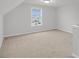 Bright bonus room with carpet flooring, natural light, and ample space for versatile use at 429 Grove End Rd, Moncks Corner, SC 29461