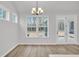 Well-lit dining area with hardwood flooring and modern lighting at 429 Grove End Rd, Moncks Corner, SC 29461