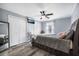 Serene bedroom with a large bed, storage drawers, neutral color palette, and a mounted television at 7930 Timbercreek Ln # C, North Charleston, SC 29418