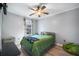 Comfortable bedroom with a queen bed, large window with natural light, and a ceiling fan at 7930 Timbercreek Ln # C, North Charleston, SC 29418