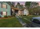 Inviting condo complex featuring a covered stairwell entrance, green lawn and convenient parking at 7930 Timbercreek Ln # C, North Charleston, SC 29418