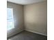 Bright bedroom featuring a window and a neutral color scheme at 7963 Weld St, North Charleston, SC 29418
