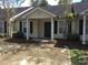 Charming single-story home with a welcoming front porch and a well-maintained yard at 7963 Weld St, North Charleston, SC 29418