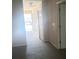 Hallway of home with white doors and neutral walls that leads to the outside at 7963 Weld St, North Charleston, SC 29418