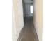 Hallway of a home featuring neutral walls and carpet, with multiple doors at 7963 Weld St, North Charleston, SC 29418