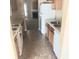 Traditional kitchen with tile flooring and basic appliances, next to the living room at 7963 Weld St, North Charleston, SC 29418