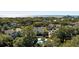 An aerial view shows a beautiful condo complex nestled amidst lush greenery near the ocean at 8 Lagoon Villas, Isle of Palms, SC 29451