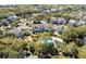 Aerial view of condo complex with a large community pool nestled among trees at 8 Lagoon Villas, Isle of Palms, SC 29451