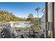 Private balcony features comfortable seating and a view of the community pool and palm trees at 8 Lagoon Villas, Isle of Palms, SC 29451