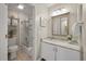 Bathroom featuring a vanity with granite counters, a large mirror, and a shower-tub combination at 8 Lagoon Villas, Isle of Palms, SC 29451