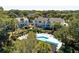 A peaceful pool view from the back highlights the property's relaxing amenities at 8 Lagoon Villas, Isle of Palms, SC 29451