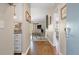 Warm and inviting hallway featuring hardwood floors and seamless transition to other living spaces at 8 Lagoon Villas, Isle of Palms, SC 29451