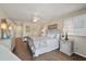 Tranquil main bedroom with hardwood floors, ceiling fan, and tasteful decor at 8 Lagoon Villas, Isle of Palms, SC 29451