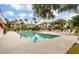 Community pool with surrounding lounge chairs and tropical landscaping at 8 Lagoon Villas, Isle of Palms, SC 29451