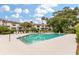 Community pool with lounge chairs, landscaping, and multi-story condos in the background at 8 Lagoon Villas, Isle of Palms, SC 29451