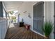 Charming porch with seating, perfect for relaxing, with a view to a tree and other buildings at 8 Lagoon Villas, Isle of Palms, SC 29451