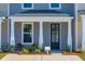Charming porch with seating and views of the surrounding neighborhood at 814 Alma Square Dr, Moncks Corner, SC 29461