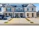 Charming townhome with a welcoming front porch and well-manicured landscaping at 814 Alma Square Dr, Moncks Corner, SC 29461
