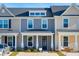 Attractive townhome featuring a covered porch and updated facade at 814 Alma Square Dr, Moncks Corner, SC 29461