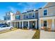 Inviting townhome exterior with covered porch, parking, and craftsman details at 814 Alma Square Dr, Moncks Corner, SC 29461