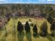 Expansive aerial view of a property featuring a well-maintained lawn, mature trees and a cozy house at 835 Gross Ave, Moncks Corner, SC 29461