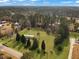 An aerial view shows the property's setting near lush woods and a road, creating a peaceful, accessible environment at 835 Gross Ave, Moncks Corner, SC 29461