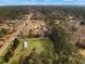 A beautiful aerial view captures home nestled amongst towering pines and a lush green lawn at 835 Gross Ave, Moncks Corner, SC 29461