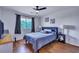 Comfortable bedroom with a ceiling fan, window with blinds and a small workspace at 87 Ashley Hall Plantation Rd # 108, Charleston, SC 29407