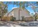 Exterior rear view of neutral townhome with privacy fence and mature trees at 87 Ashley Hall Plantation Rd # 108, Charleston, SC 29407