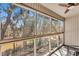 Sunroom patio with full wall of floor to ceiling windows overlooking mature trees at 87 Ashley Hall Plantation Rd # 108, Charleston, SC 29407