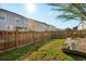 A fenced backyard with a wooden deck provides privacy and a great outdoor space at 8816 Kellum Dr, North Charleston, SC 29420