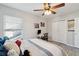 Bedroom with a ceiling fan, natural light from the window and closet at 8816 Kellum Dr, North Charleston, SC 29420