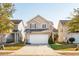 Two-story home with a driveway basketball hoop situated between neighboring homes at 8816 Kellum Dr, North Charleston, SC 29420
