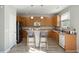 Well-lit kitchen boasts sleek wooden cabinetry, stainless appliances, and a practical island at 8816 Kellum Dr, North Charleston, SC 29420
