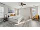 Spacious bedroom with a large bed, stylish rug, ceiling fan, and natural light, offering a serene retreat at 8816 Kellum Dr, North Charleston, SC 29420